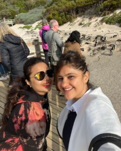 Archana Instagram - Day 02 #capetownsouthafrica 
 
On our day tour visited the #penguin colony at Boulders Beach & loved the way no one hushed whistled or bullied the animals by any notice or action … penguins are very private creatures and just love to chill with their tribe … delight to visit their nesting holes by the beach & see them snuggle and huddle with their loved ones … like my tribe is as huddling for pictures with them :D

Don’t miss the #possum sneakily looking towards me in the bushes 🫣🙈🤪
.
.
.
#love #naturephotography #wildlife #beach #travel