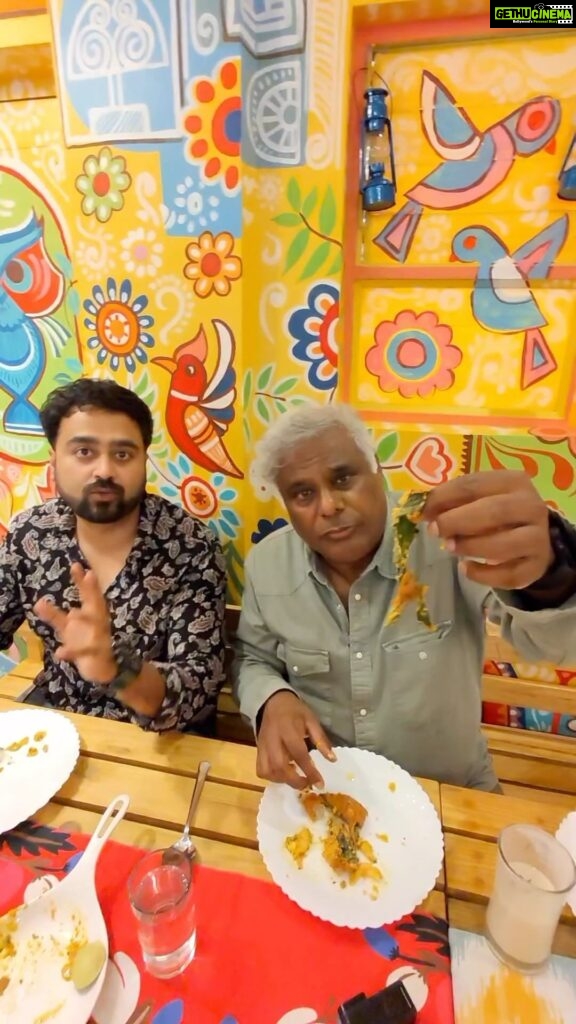 Ashish Vidyarthi Instagram - Bangladeshi Food Mukbang: East Bengal Meets West Bengal Cuisine *Unbelievable* 🤤😳😍 Ft @livingwithrahul Watch full video on YouTube-Ashish Vidyarthi Actor Vlogs We are headed to an amazingly colourful place, where artistic strokes of Bangladeshi Alpona designs decorate the walls complimenting the Pata Chitra Kala of West Bengal. An experience presented to the eyes and hearts served with a soulful feast of East and West Bengal Cuisine is to die for! And to top this up, in this vlog, today we have two very special people, ‘Vlogger’ by profession and a “couple” by Relation: Rahul & Kajori who introduced us to this incredible place called, “Himur Heshel.” Run by Sutapa Barua, who hails from Bangladesh has translated her dreams into reality through this boutique restaurant inspiring us all to never stop pursuing our dreams. As Rahul, Kajori and I sat down to taste the platter of authenticity waiting to be served, little did we know that this would turn into a mouthwatering Mukbang. From Gondhoraj Ghol, Dhakai Morog Polau, Mutton Kala Bhuna, Mangsher Chop, Gondhoraj Chingri, Dhakai Chicken Pakora and many more delicious delicacies served one after the other till we couldn’t have more. I invite you all, dear friends, to come and experience Himur Heshel. Ufff! You cannot miss this artistic and gastronomic fusion that delights the soul in this beautiful City of Joy, Kolkata. Alshukran Rahul & Kajori for this amaaazziiing experience, Alshukran Bandhu, Alshukran Zindagi ❤️🙏🏻 #food #bangladeshi #cuisine #foodblogger #foodie #fish #mutton #chickenbiryani #pulao #actorvlogs #ashishvidyarthi #foodie
