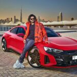 Dulquer Salmaan Instagram - A big bucket list dream come true for me. Featuring on the cover of @topgearmagindia for their 3rd Anniversary Issue. It was a weekend that felt less like work and more like play. I got to fool around at the @dubaiautodrome in an @audiin RS E-Tron GT and a @mclaren GT as part of my job 😱😱 Many thanks to @ramesh_somani and the entire team of TG India for the honour and pleasure that this shoot was. Ramesh you’ve become a friend for life and chatting cars with you the whole time was the best kind of conversations. Thank you for letting me do this. Often times between work I don’t find the time. More of this in the new issue. @visit.dubai Styled by @harmann_kaur_2.0 Photographer @browning_hill Make up @av_ratheeshcinema Hair @saurabhbhatkar