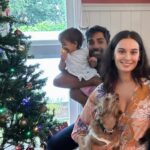 Evelyn Sharma Instagram – Christmas at the Bhindi’s 😅🎄 best we could do for a family photo on #ChristmasEve trying to stop Ava from tipping the tree and Coco from unwrapping the gifts 😅 #family #love #merrychristmas
