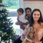 Evelyn Sharma Instagram - Christmas at the Bhindi’s 😅🎄 best we could do for a family photo on #ChristmasEve trying to stop Ava from tipping the tree and Coco from unwrapping the gifts 😅 #family #love #merrychristmas