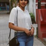 Lakshmi Menon Instagram - ʏᴏᴜ ᴛʜɪɴᴋ ʏᴏᴜ ᴋɴᴏᴡ ᴍᴇ? ᴛʜɪɴᴋ ᴀɢᴀɪɴ. Pc: @rhisvan #lakshmimenon #kollywood #tollywood#photography#whiteshirts #loveyourself #boldandbeautiful #redlipstick #happysoul #positiveenergy