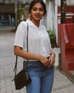 Lakshmi Menon Instagram - ʏᴏᴜ ᴛʜɪɴᴋ ʏᴏᴜ ᴋɴᴏᴡ ᴍᴇ? ᴛʜɪɴᴋ ᴀɢᴀɪɴ.

Pc: @rhisvan 

#lakshmimenon #kollywood #tollywood#photography#whiteshirts #loveyourself #boldandbeautiful #redlipstick #happysoul #positiveenergy