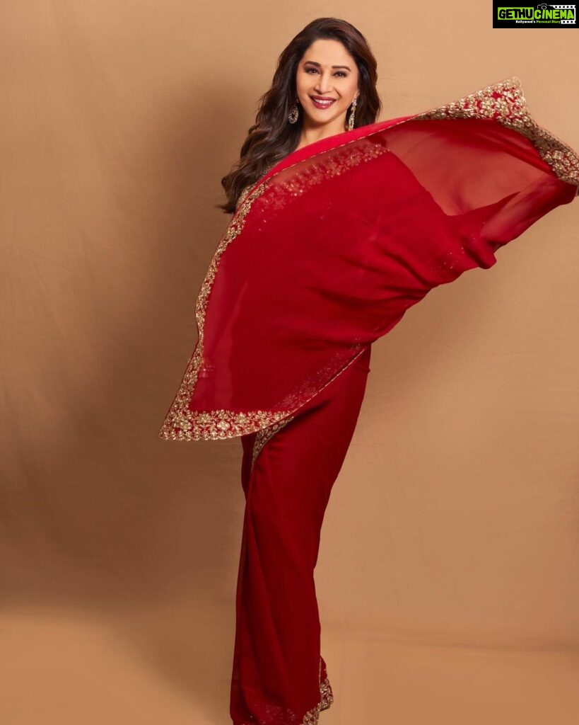 Madhuri Dixit Instagram - Heard melodies are sweet, but those unheard are sweeter! #tuesday #tuesdaythoughts #photoshoot #photooftheday #redsaree #sareelove