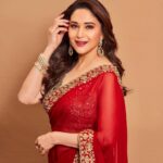 Madhuri Dixit Instagram – Heard melodies are sweet, but those unheard are sweeter! 

#tuesday #tuesdaythoughts #photoshoot #photooftheday #redsaree #sareelove