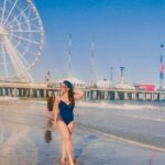 Mannara Instagram - “Embracing the arrival of my debut singing #zarazara by soaking up the beach vibes and surrendering to the rhythmic melody of the Atlantic Ocean.” Find the link to my original cover song in my bio ⬆️↖️