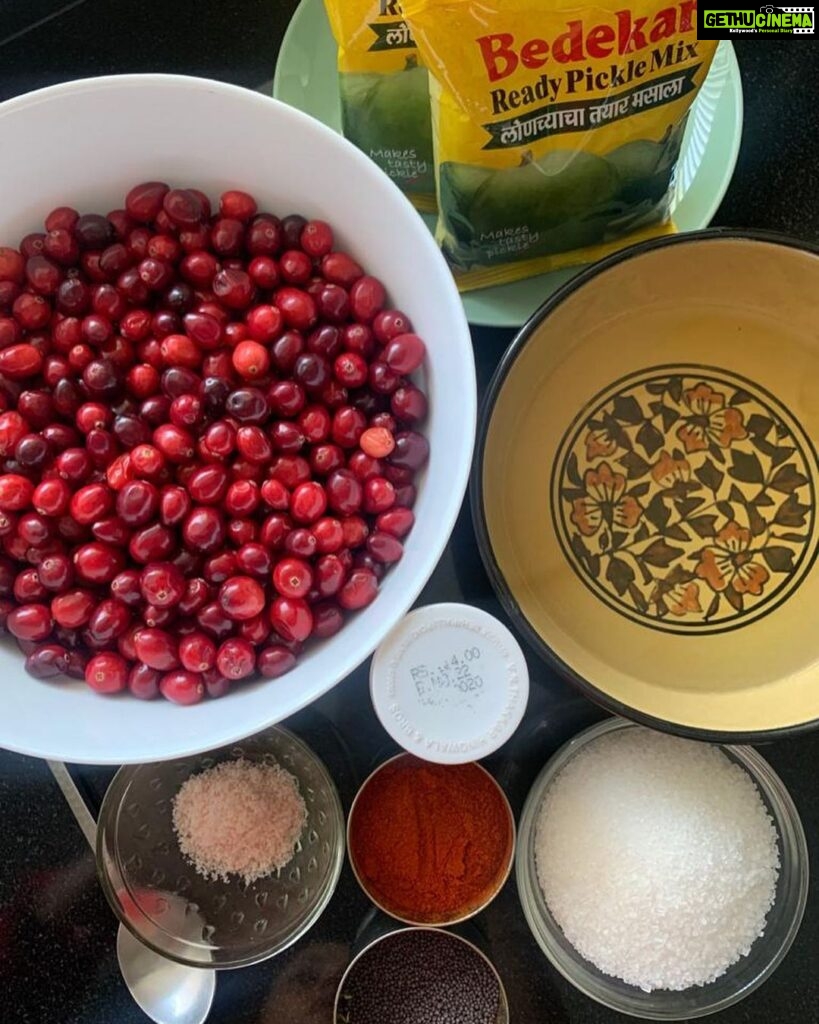 Nadhiya Instagram - Sweet and Sour Cranberry Pickle 🍒 Winter time favorite! Ingredients: 500 gms fresh cranberries (not dried) 1.5 cups cooking oil (either groundnut oil or sunflower oil) 5-6 teaspoons mustard seeds 2 teaspoons asafoetida 2 teaspoons chili powder 150 gms mango pickle masala 3/4 cup sugar Salt Recipe: 1. Wash and dry the cranberries and then cut the cranberries in halves. 2. Pour the oil into the vessel. 3. Turn the flame up. 4. Once the oil is hot, lower the flame and add mustard seeds, asafoetida, chilli powder and then immediately turn the gas off. 5. Add pickle masala and cranberries to the vessel. 6. Add salt and sugar as per your taste. 7. Mix all the ingredients together till it turns into a gravy/pickle texture. 8. Keep the vessel aside and stir the pickle every 2-3 hours. *Check for salt and sugar according to your taste because the cranberries release their flavors over time. *Remove excess oil if needed. After 1-2 days, store the pickle in a glass bottle and refrigerate. #cranberry #cranberrypickle #homecooking #mondaymotivation