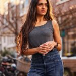 Rukmini Vijayakumar Instagram - Next one in this series…. I have been keeping lots of my life away from Instagram. Which is why so many of you think that jeans and a tank are a new look for me. 😊. I wear jeans and tanks and shorts and dresses a lot. So many of you have also been asking about my lipstick or skin/ hair care. I’ll share a little bit more than my dance life and training…going forward. You’ll be seeing a lot more of life…. And maybe some “new looks” ♥️ (which are not really new for me 😁) Photography: @sunnyjagesar Location: Amsterdam Jeans : @freepeople Tank : @marksandspencer Lipstick : I think Mocha from @maccosmetics