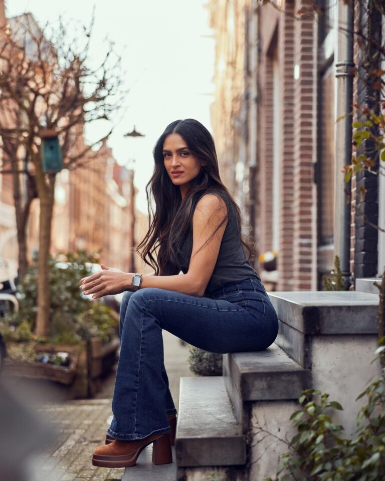 Rukmini Vijayakumar Instagram - People have been asking where I get my clothes from…. So I’ll try to share whenever I remember from now on. Jeans: @freepeople Tank top: @marksandspencerindia Boots: I forgot - sorry 😞 This photo was taken by my dear friend @sunnyjagesar and you’re all going to be seeing a series of photos that I shot with him 😊 #netherlands #photography #jeans #browngirl #amsterdam