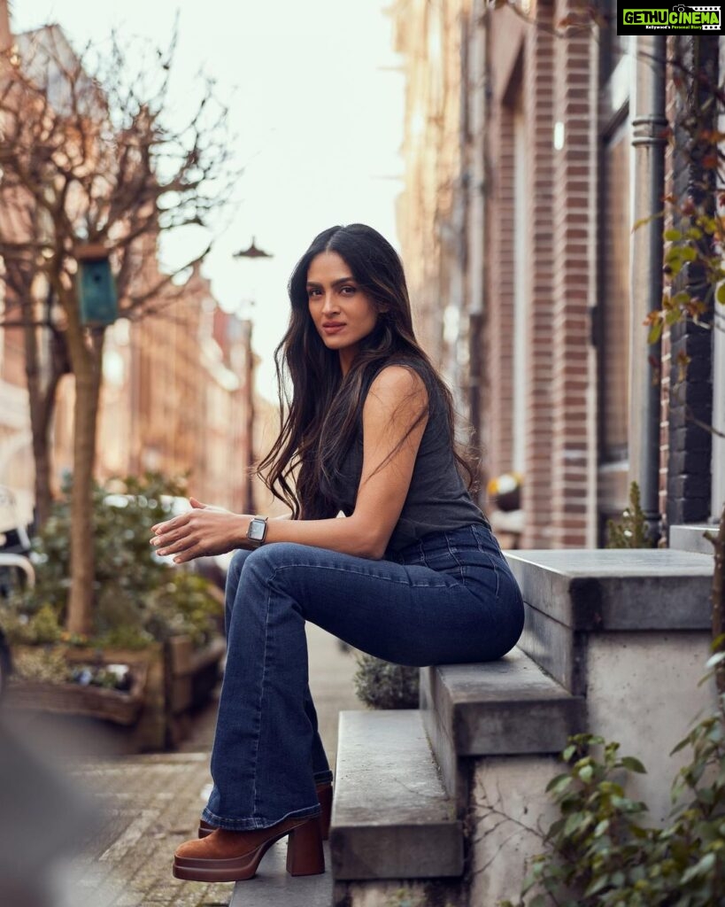 Rukmini Vijayakumar Instagram - People have been asking where I get my clothes from…. So I’ll try to share whenever I remember from now on. Jeans: @freepeople Tank top: @marksandspencerindia Boots: I forgot - sorry 😞 This photo was taken by my dear friend @sunnyjagesar and you’re all going to be seeing a series of photos that I shot with him 😊 #netherlands #photography #jeans #browngirl #amsterdam