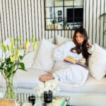 Tara Sutaria Instagram - Reading @stanleytucci’s cook book with a hot cup of tea and watching the rain in my favourite corner at home.. Nothing quite like it! ☕️📚