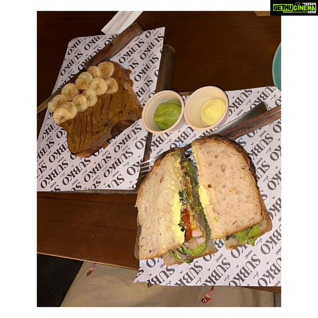 Vaibhavi Shandilya Instagram - Must scroll all the way to the left to see my reaction to this place. In the meanwhile- Virtually indulge in a heavenly feast of flavors and aromas with me at @subkocoffee - from the rich and nutty hazepresso babka to the savory the green one chicken sandwich and bacon and caramelized onion sandwich, to the sweet and satisfying sourdough almond butter toast with sliced bananas. Wash it all down with our refreshing iced coffee (strong) or velvety honey cappuccino. #café #cafelove #coffee #sandwhich #toast #babka #subko #bandra Mumbai, Maharashtra