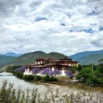 Andrea Jeremiah Instagram - The magnificent #punakhadzong !!! It is the second oldest & second largest #dzong in Bhutan… situated between two rivers & surrounded by gorgeous jacaranda blossoms, it’s quite a sight to behold 💜💜💜 @gtholidays.in #bhutan #punakha #solotravel #gtholidays #shotoniphone