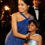 Freida Pinto Instagram - Every year around this time I feel so much nostalgia about this little engine that could called Slumdog Millionaire. It was such a glorious celebration of the underdog. The misfit that came kicking and screaming into the world and touched so many hearts and minds. It's been 14 years and our little baby that almost went straight to DVD ( fact!) still brings up the same kind of unadulterated joy and hope to me and many around me. I sometimes still have moments of disbelief but the older I get I've learned to own the little achievements because it was against all odds and it was no mean feat. Believe it..this happened! And you deserve it! I also want to remember Irrfan Khan who isn't with us anymore as well as Satish Kaushik passed away a few days ago. Two legends from the Indian film industry. Hope you are reunited in the afterlife and having your own party. Also do not miss Dev hoisting the then little Rubina Ali to take in that enormous moment. We could feel the support from every corner of that room. It's been an absolute marvelous journey of peaks and valleys since then but will save that for another time. Congratulations to all the nominees this year and to all the great work of art in cinema that may not have been nominated. You told your story your way and that in itself is an incredible feat. Los Angeles, California