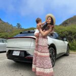 Freida Pinto Instagram - Let’s title this one trying to take a photo with your baby — they don’t sit still. Thank you @kiausa for letting us try out your fabulous EV6 over Monterey Car Week! Carmel by the Sea