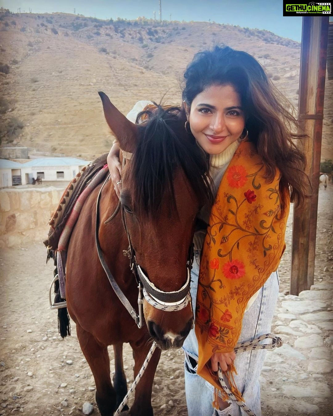 Iswarya Menon Instagram - The first time I ever spoke to a horse 🥺❤️ Do you believe in animal communication? I do! I do that with @coffeemenon every single time 🥺 They understand every emotion, every thought of yours, you can talk to them telepathically. One such experience was with this horse 🥺❤️ . In Petra, jordan. My shoes broke on the way , it was a long way back to my hotel .. and the pathway was full of rocks, so it was impossible for me to walk barefoot back to the hotel . I happened to ride on this particular horse .. He kept halting on the way, showing his disinterest in walking. He kept nodding his head to his owner and refused to move! I got down , requested him to help me, explained my situation, spoke to him eye to eye , gave him a hug 🥺 & on my request he walked without halting all the way for me 😞❤️ This blew my mind! Are we human beings as empathetic as they are ?
