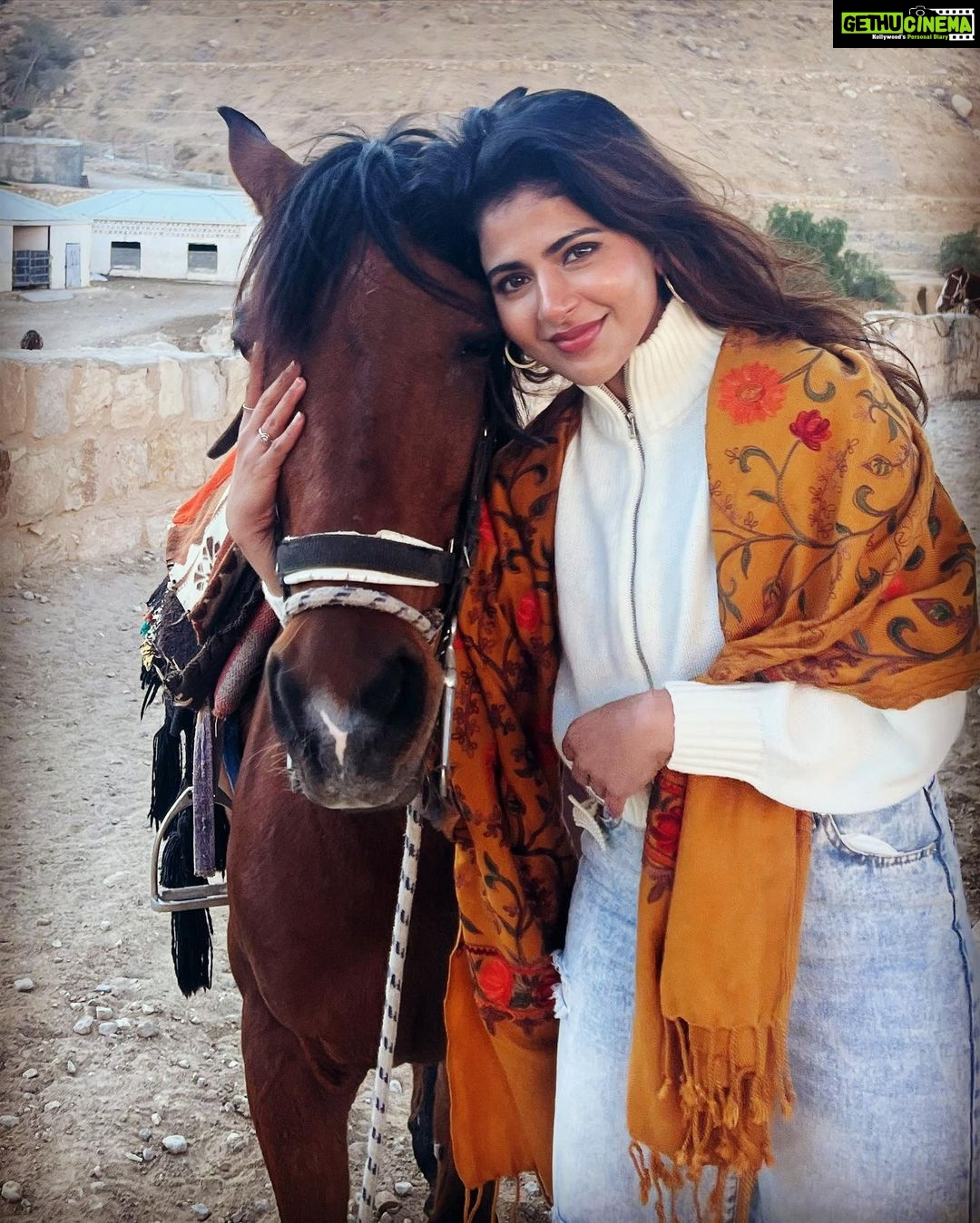 Iswarya Menon Instagram - The first time I ever spoke to a horse 🥺❤️ Do you believe in animal communication? I do! I do that with @coffeemenon every single time 🥺 They understand every emotion, every thought of yours, you can talk to them telepathically. One such experience was with this horse 🥺❤️ . In Petra, jordan. My shoes broke on the way , it was a long way back to my hotel .. and the pathway was full of rocks, so it was impossible for me to walk barefoot back to the hotel . I happened to ride on this particular horse .. He kept halting on the way, showing his disinterest in walking. He kept nodding his head to his owner and refused to move! I got down , requested him to help me, explained my situation, spoke to him eye to eye , gave him a hug 🥺 & on my request he walked without halting all the way for me 😞❤️ This blew my mind! Are we human beings as empathetic as they are ?