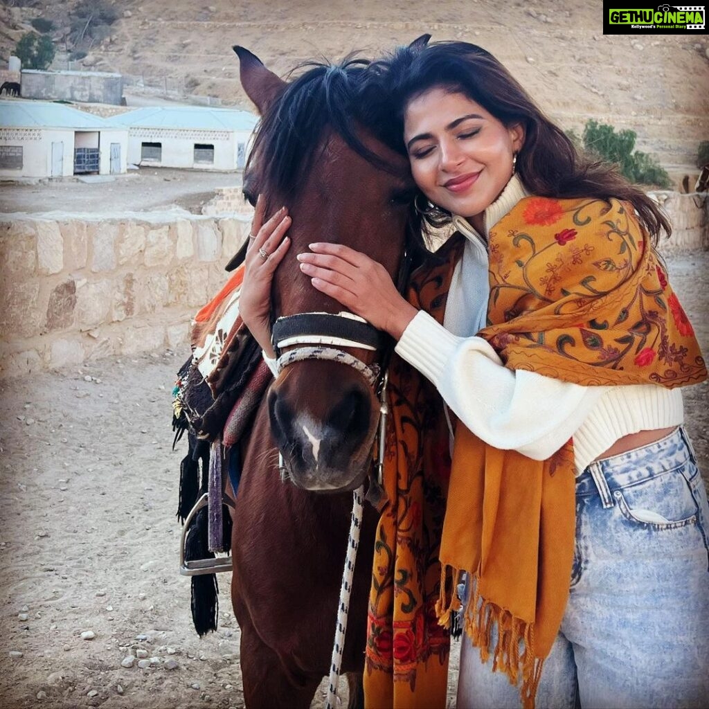 Iswarya Menon Instagram - The first time I ever spoke to a horse 🥺❤️ Do you believe in animal communication? I do! I do that with @coffeemenon every single time 🥺 They understand every emotion, every thought of yours, you can talk to them telepathically. One such experience was with this horse 🥺❤️ . In Petra, jordan. My shoes broke on the way , it was a long way back to my hotel .. and the pathway was full of rocks, so it was impossible for me to walk barefoot back to the hotel . I happened to ride on this particular horse .. He kept halting on the way, showing his disinterest in walking. He kept nodding his head to his owner and refused to move! I got down , requested him to help me, explained my situation, spoke to him eye to eye , gave him a hug 🥺 & on my request he walked without halting all the way for me 😞❤️ This blew my mind! Are we human beings as empathetic as they are ?