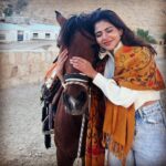 Iswarya Menon Instagram – The first time I ever spoke to a horse 🥺❤️
Do you believe in animal communication? I do!
I do that with @coffeemenon every single time 🥺
They understand every emotion, every thought of yours, you can talk to them telepathically.
One such experience was with this horse 🥺❤️
.
In Petra, jordan. My shoes broke on the way , it was a long way back to my hotel .. and the pathway was full of rocks, so it was impossible for me to walk barefoot back to the hotel .
I happened to ride on this particular horse ..
He kept halting on the way, showing his disinterest in walking. He kept nodding his head to his owner and refused to move!
I got down , requested him to help me, explained my situation, spoke to him eye to eye , gave him a hug 🥺
& on my request he walked without halting all the way for me 😞❤️ 
This blew my mind!
Are we human beings as empathetic as they are ?