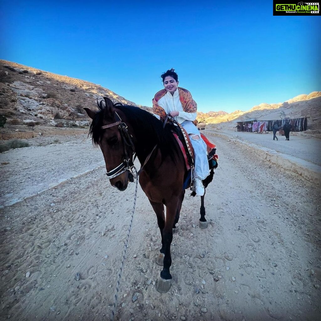 Iswarya Menon Instagram - The first time I ever spoke to a horse 🥺❤️ Do you believe in animal communication? I do! I do that with @coffeemenon every single time 🥺 They understand every emotion, every thought of yours, you can talk to them telepathically. One such experience was with this horse 🥺❤️ . In Petra, jordan. My shoes broke on the way , it was a long way back to my hotel .. and the pathway was full of rocks, so it was impossible for me to walk barefoot back to the hotel . I happened to ride on this particular horse .. He kept halting on the way, showing his disinterest in walking. He kept nodding his head to his owner and refused to move! I got down , requested him to help me, explained my situation, spoke to him eye to eye , gave him a hug 🥺 & on my request he walked without halting all the way for me 😞❤️ This blew my mind! Are we human beings as empathetic as they are ?