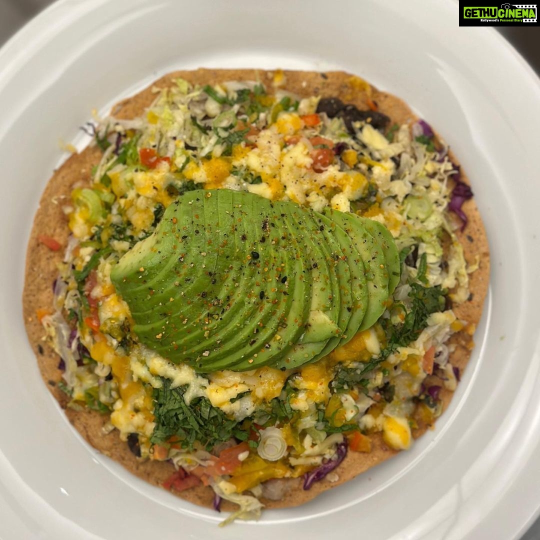 Parvathy Omanakuttan Instagram - Taco Pizza 🌮 +🍕 “People who don’t like Taco or Pizza are rare. When one can enjoy a bit of both, there is nothing to compare” - PO😜 This is our favorite mid-week meal. It keeps our spirits up through stressful work days. Get your knife and cutting board or even a vegetable slicer if you are not a pro, but try this recipe and let me know how it goes. Ingredients: - Home made roti of your choice (I am using spelt flour rotis with flax seeds and chia seeds) - Vegetables 1. Red Cabbage 2. Lettuce 3. Black beans soaked and boiled 4. Tomatoes (skinned and de seeded) 5. Capsicum (as many colours as you can get) 6. Organic sweet corn (*optionalif you can find some) 7. Scallion / Spring onions 8. Mint leaves 9. Coriander leaves 10. Salt 11. Pepper 12. Paprika powder 13. Pickled Olives & Jalapeño (*Also optional) 14. Fresh grated cheese ( Pepper Jack, Yellow cheddar , White Cheddar) 15. Avocado 🥑 - Crisp up the roti on a tava or in oven at 150 C for 15-20 mins until they are crisp - Thinly slice all vegetables (helps to speed up the cooking in the oven/ tava) - Top up all veggies (except avocado), herbs and cheese of the crisp roti - Bake in the oven until cheese starts to melt or place in a frying pan with the lid on to let the vegetables steam slightly and the cheese to melt - Place on the serving plate, sprinkle salt, pepper and paprika - Enjoy 😉 #instagram #love #vegetarian #food #foodie #health #healthyfood #plantbased #foodporn #instafood #healthy #foodphotography #homemade #foodblogger #foodstagram #yummy #healthylifestyle #vegetarianfood #vegetarianrecipes #delicious #veggie #organic #foodlover #vegetables #foodgasm #healthyeating #foodnetwork #culinary #cheflife #instagood Home sweet home