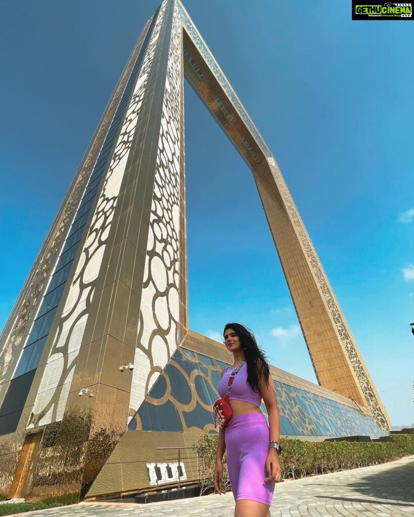 Soundariya Nanjundan Instagram - The Dubai Frame is the ultimate game of hide-and-seek - except you can't really hide behind a frame that big🤭 💜 📸- @bhoopalm_official Outfit- @hm 💼- @guess #styledbyme 💜 💜 💜 💜 💜 💜 #soundariyananjundan #dubaiframe #dubai #uae #dubailife #love #fashion #instagram #instagood #india #travel #photography #dubaifashion #dubailifestyle #uae🇦🇪 #kannadiga #chennai #outfit #followforfollowback #likesforlike #instalike #travelphotography #destination #purple #ootd #photography #fashionblogger #blogger #influencer #model