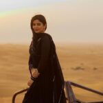 Soundariya Nanjundan Instagram - Black and the desert: a striking contrast of colors 🖤 🐪 📸- @bhoopalm_official 🐪 🐪 🐪 🐪 🐪 🐪 #soundariyananjundan #desert #travel #nature #photography #desertlife #travelphotography #adventure #instalike #love #instadaily #sunset #dubai #photooftheday #instagood #sahara #instagood #followforfollowback #art #travelgram #sand #explore #naturephotography #uae #model #mountains #wanderlust #photo #instagram #desertvibes