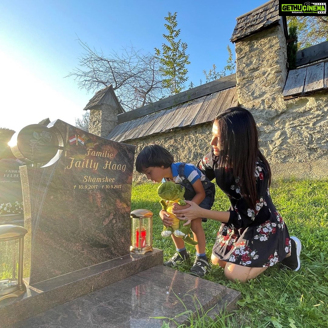 Celina Jaitly Instagram - ♥️HAPPY BIRTHDAY TO OUR ARTU♥️ Today our baby @arthurjhaag turned 6. My husband @haag.peter captured some beautiful moments today during our visit to the grave of @arthurjhaag s twin brother-baby Shamsher, whom we lost to a heart condition. Artu wanted his new pet Dinosaur to meet Shamsher on their birthday. The older twins @winstonjhaag & @viraajjhaag placed little cars on Shamsher’s grave leaving us all moist eyed. Todays birthday celebrations were bitter sweet but very blessed. A hike in the morning with his daddy followed by loads of icecream cake and treats. Artu also insisted on fulfilling his duty of donating toys that he does not play with anymore as per our family tradition as he had the opportunity to shop for new toys of his choice as his birthday present. Artu’s birthday is such a blessing for it is always a reminder to us of the fact that there is always a light at the end of a tunnel. As memories saturate my heart and the story spills from my eyes I am so grateful that I have lived to tell these stories. Remember courage is an accumulation of small steps… Our Artu did not only bring immense joy and laughter to my grief stricken moments but he also taught me that- “I can be changed by what happens to me. But I refuse to be reduced by it!! “ #celinajaitly #6thbirthday #arthurjhaag #twinsplusone #birthdayboy #celina #celinajaitley #bollywood #motivation #overcomingobstacles #missindia #missuniverse #austria #internationalfamily #indian Austria, Europe