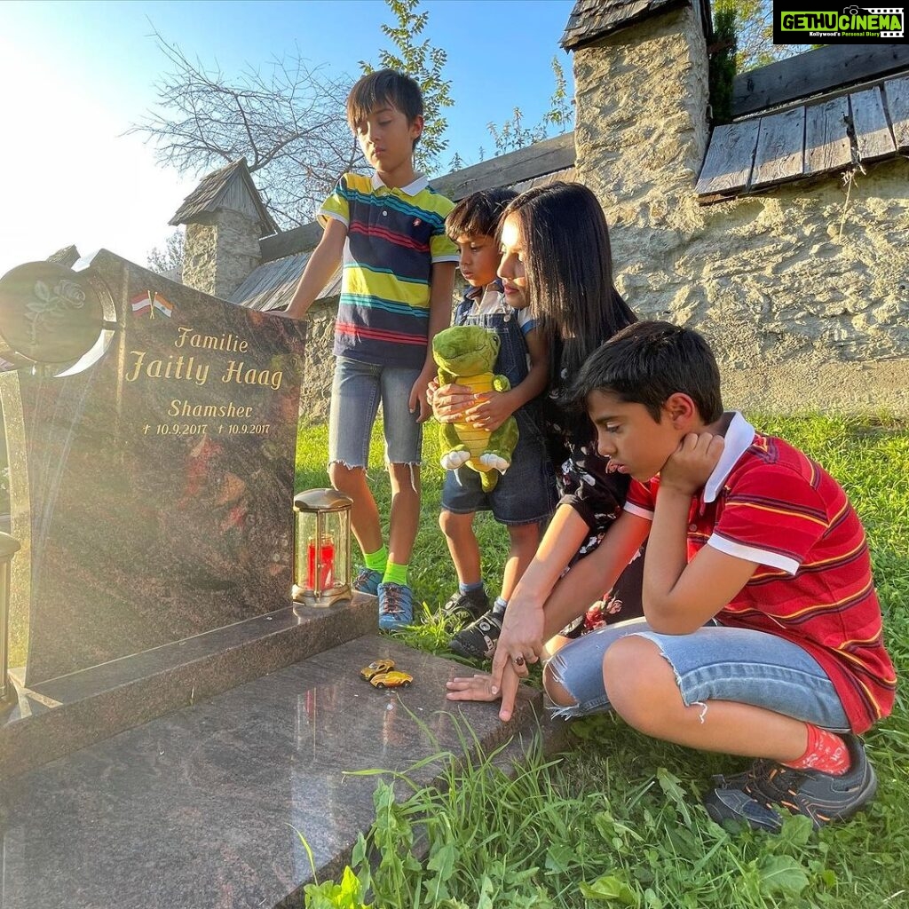 Celina Jaitly Instagram - ♥️HAPPY BIRTHDAY TO OUR ARTU♥️ Today our baby @arthurjhaag turned 6. My husband @haag.peter captured some beautiful moments today during our visit to the grave of @arthurjhaag s twin brother-baby Shamsher, whom we lost to a heart condition. Artu wanted his new pet Dinosaur to meet Shamsher on their birthday. The older twins @winstonjhaag & @viraajjhaag placed little cars on Shamsher’s grave leaving us all moist eyed. Todays birthday celebrations were bitter sweet but very blessed. A hike in the morning with his daddy followed by loads of icecream cake and treats. Artu also insisted on fulfilling his duty of donating toys that he does not play with anymore as per our family tradition as he had the opportunity to shop for new toys of his choice as his birthday present. Artu’s birthday is such a blessing for it is always a reminder to us of the fact that there is always a light at the end of a tunnel. As memories saturate my heart and the story spills from my eyes I am so grateful that I have lived to tell these stories. Remember courage is an accumulation of small steps… Our Artu did not only bring immense joy and laughter to my grief stricken moments but he also taught me that- “I can be changed by what happens to me. But I refuse to be reduced by it!! “ #celinajaitly #6thbirthday #arthurjhaag #twinsplusone #birthdayboy #celina #celinajaitley #bollywood #motivation #overcomingobstacles #missindia #missuniverse #austria #internationalfamily #indian Austria, Europe