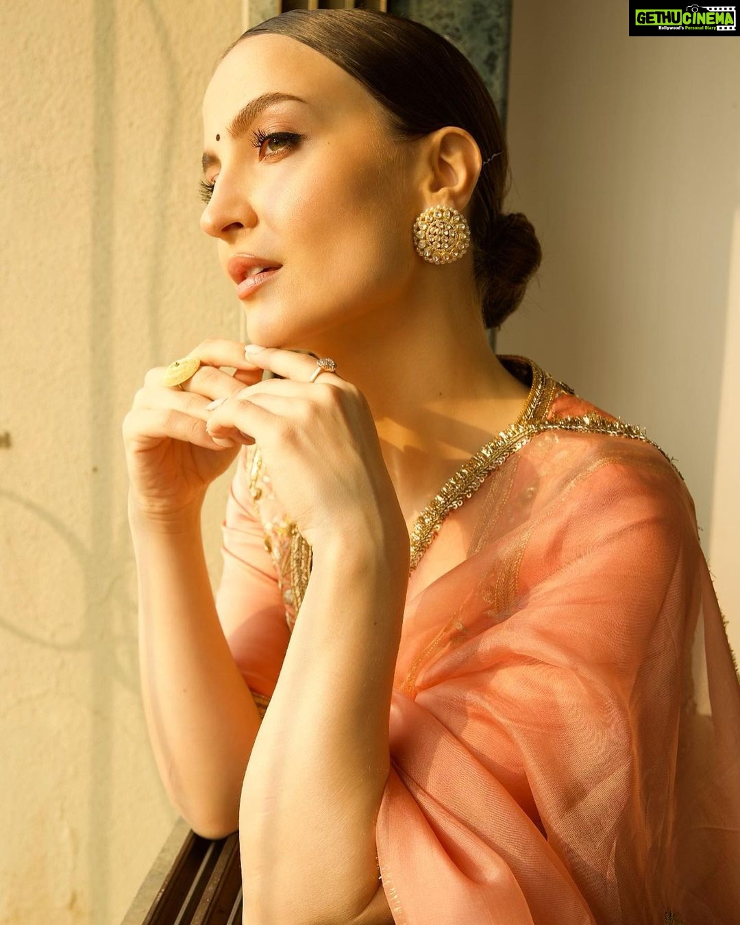Elli AvrRam Instagram - Be timeless🤍 Saree - @raw_mango Earrings by - @avior.jewels rings by - @kharikajai Styled by- @juhi.ali Photographer - @nikhilshenoyphoto Makeup & Hair by - @jyotii.90 @thakuramit190 #ElliAvrRam #yourstruly