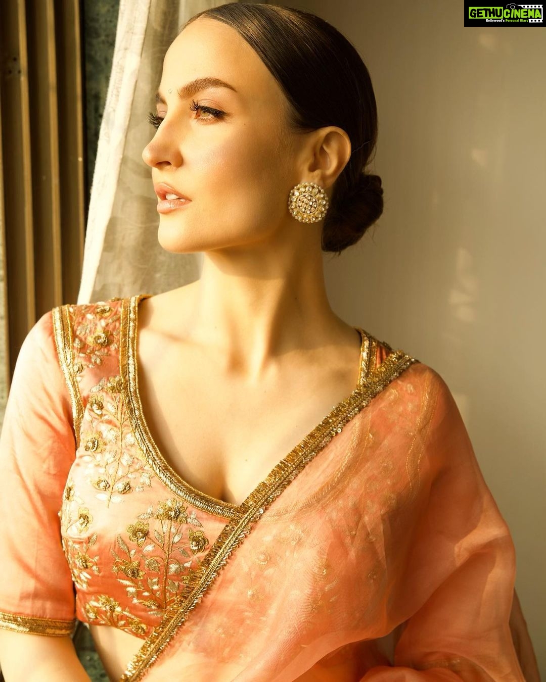 Elli AvrRam Instagram - Be timeless🤍 Saree - @raw_mango Earrings by - @avior.jewels rings by - @kharikajai Styled by- @juhi.ali Photographer - @nikhilshenoyphoto Makeup & Hair by - @jyotii.90 @thakuramit190 #ElliAvrRam #yourstruly