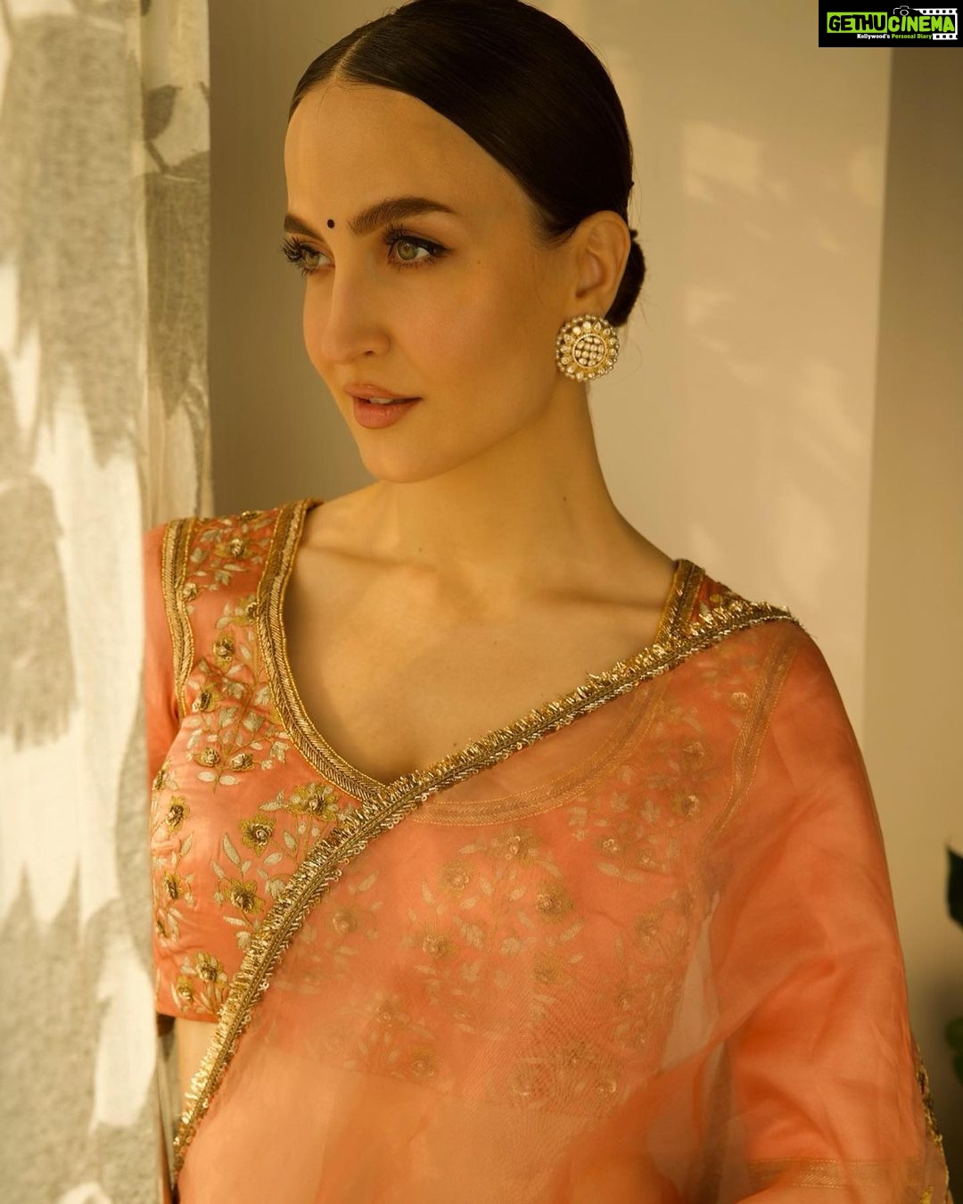 Elli AvrRam Instagram - Be timeless🤍 Saree - @raw_mango Earrings by - @avior.jewels rings by - @kharikajai Styled by- @juhi.ali Photographer - @nikhilshenoyphoto Makeup & Hair by - @jyotii.90 @thakuramit190 #ElliAvrRam #yourstruly