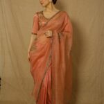 Elli AvrRam Instagram - Sarees have a separate spot in my closet and heart🤍 What about you? Saree - @raw_mango Earrings by - @avior.jewels rings by - @kharikajai Styled by- @juhi.ali Photographer - @nikhilshenoyphoto Makeup & Hair by - @jyotiiadvani.artistry @thakuramit190 #elliavrram #sareelove #desi #fashion #yourstruly