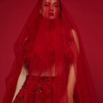 Elli AvrRam Instagram - Your Lady in Red with a new touch✨ New Year’s special edition of @fablookmagazine ✨ Wearing @borahoneys luxury Indian couture. Editor & Founder @milliarora7777 @ankkit.chadha2222 Styled by @milliarora7777 Outfit designer @borahoneys Photographer @nikhilshenoyphoto Mua @omkarvardam Hair @swapnil_makeupnhair Coordinated by @nadiiaamalik