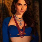 Elli AvrRam Instagram - “I think fashion cannot be what we have normalised; What we feel is nice or not, this is how one should look, or a gown should look, or a certain look should be! I think fashion is when you constantly create something new which then is interpreted in so many different ways.” — @elliavrram Hit the link in bio, November’22 issue to read the full story. Produced By: @facemag.in Publisher: @harshithundet @kanchanshrivastava06 Creative Director: @farrahkader Editor In Chief: @nehasachar Photographed by: @vievekdesai Stylist: @sameerkatariya92 Makeup Artist: @kanika_arrora Asst. Makeup Artist: @mua_mitanshidabi & @fatema_m92 Digitech: @greesha_desai Fashion Assistant: @aditi.abhijit Video shot by: @rangpictures Video edited by: @thakkar_miten Location: @obeetee Artist PR Agency: @communiquefilmpr On Elli Lehenga: @plumtin_motif @amigos.rizwan Top: @eshaamiinlabel1 Jewellery: @nwshamsettjewellers www.facemagazine.in #FaceMagazine #ElliAvrRam #Magazine #EthnicWear #Bollywood #Actress #Inspiration #Fashion
