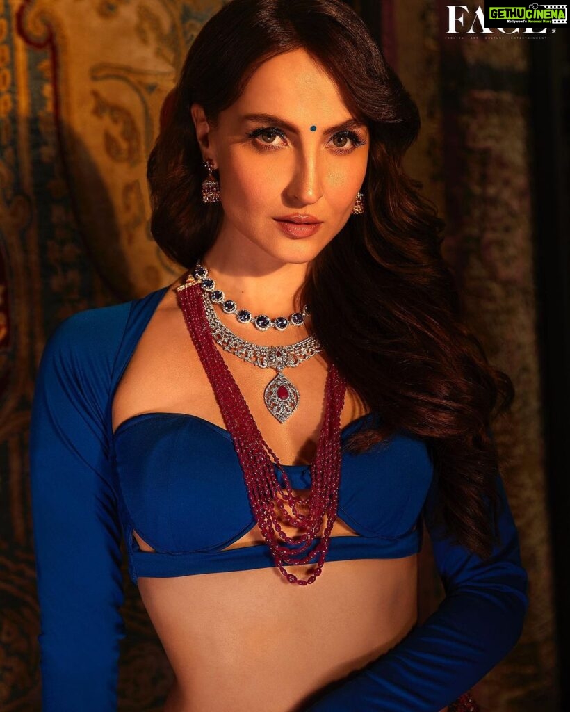 Elli AvrRam Instagram - “I think fashion cannot be what we have normalised; What we feel is nice or not, this is how one should look, or a gown should look, or a certain look should be! I think fashion is when you constantly create something new which then is interpreted in so many different ways.” — @elliavrram Hit the link in bio, November’22 issue to read the full story. Produced By: @facemag.in Publisher: @harshithundet @kanchanshrivastava06 Creative Director: @farrahkader Editor In Chief: @nehasachar Photographed by: @vievekdesai Stylist: @sameerkatariya92 Makeup Artist: @kanika_arrora Asst. Makeup Artist: @mua_mitanshidabi & @fatema_m92 Digitech: @greesha_desai Fashion Assistant: @aditi.abhijit Video shot by: @rangpictures Video edited by: @thakkar_miten Location: @obeetee Artist PR Agency: @communiquefilmpr On Elli Lehenga: @plumtin_motif @amigos.rizwan Top: @eshaamiinlabel1 Jewellery: @nwshamsettjewellers www.facemagazine.in #FaceMagazine #ElliAvrRam #Magazine #EthnicWear #Bollywood #Actress #Inspiration #Fashion