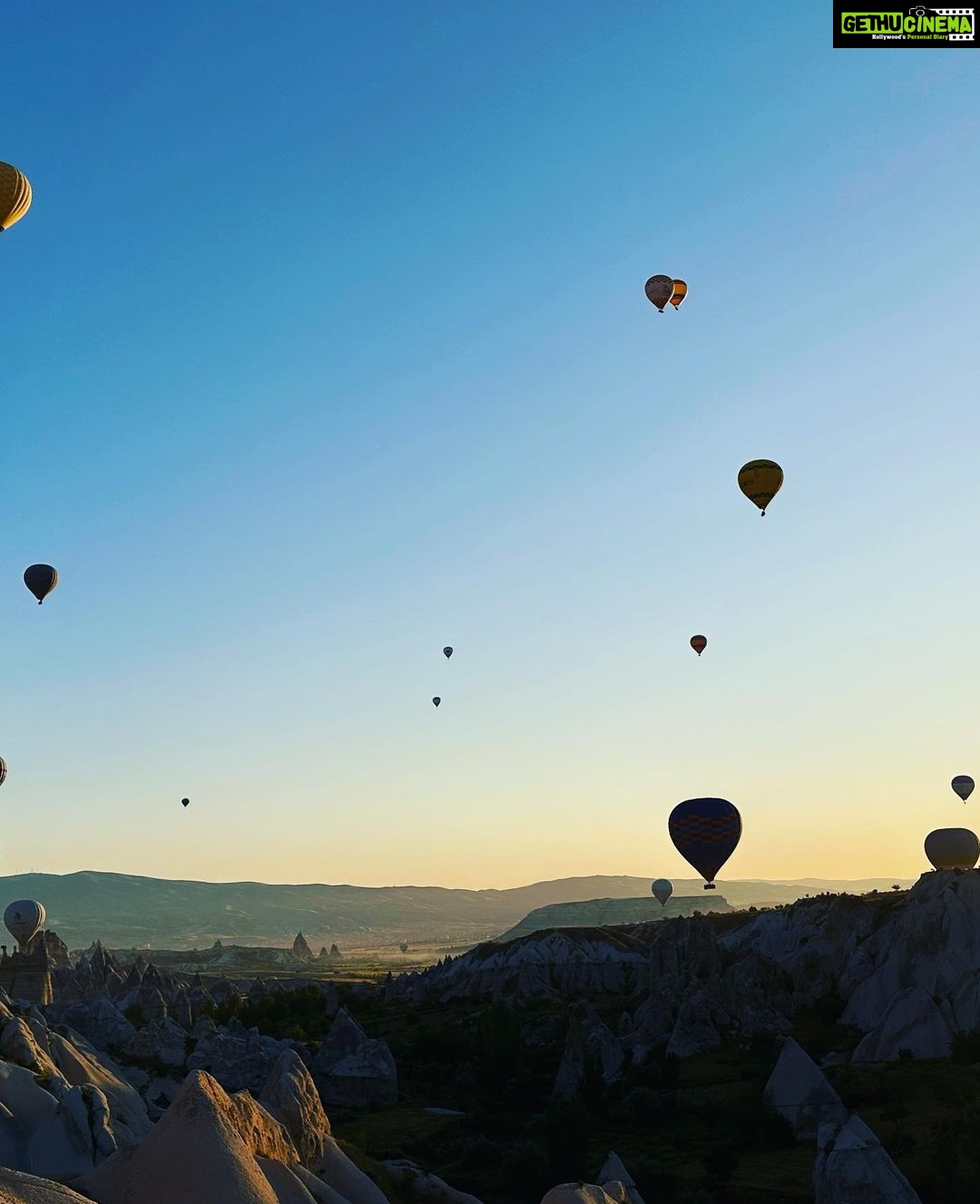 Gul Panag Instagram - Full of hot air. Literally. Our second time in Capadoccia. And just as magical. The hot air balloon ride is arguably one of the finest experiences that I’ve ever had. This time around, we had Nihal with us who was mesmerised. Seeing it all over again through his eyes, was an altogether different experience. Since we are here in the middle of summer, the days are very long , with sunrise at 5 AM. The balloon pilots typically take us up a little before so one can witness the sunrise in all its glory. Our pick up was at 3.45 AM. And Nihal was an absolute trooper. In fact, we woke up at 2.30 ( not unusual for Rishi, given his job💁🏻♀️,) cup of tea, when Nihal walked into the living room, rubbing his eyes. Hence, proved yet again, there are children will surprise us again and again. Like he did on the trek up to the Tigers’s nest in Bhutan are early this year. #travel #turkey #familytravel #travelgram Cappadocia