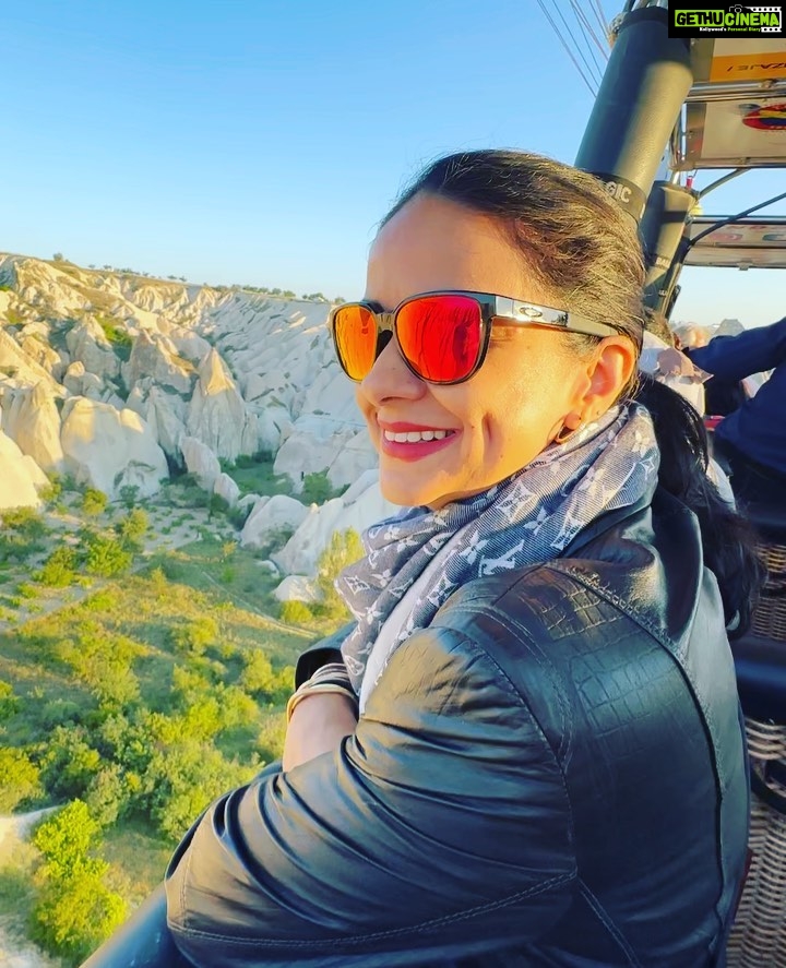 Gul Panag Instagram - Full of hot air. Literally. Our second time in Capadoccia. And just as magical. The hot air balloon ride is arguably one of the finest experiences that I’ve ever had. This time around, we had Nihal with us who was mesmerised. Seeing it all over again through his eyes, was an altogether different experience. Since we are here in the middle of summer, the days are very long , with sunrise at 5 AM. The balloon pilots typically take us up a little before so one can witness the sunrise in all its glory. Our pick up was at 3.45 AM. And Nihal was an absolute trooper. In fact, we woke up at 2.30 ( not unusual for Rishi, given his job💁🏻♀️,) cup of tea, when Nihal walked into the living room, rubbing his eyes. Hence, proved yet again, there are children will surprise us again and again. Like he did on the trek up to the Tigers’s nest in Bhutan are early this year. #travel #turkey #familytravel #travelgram Cappadocia