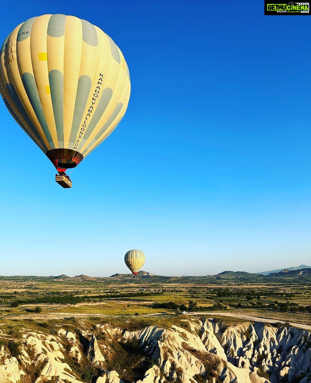 Gul Panag Instagram - Full of hot air. Literally. Our second time in Capadoccia. And just as magical. The hot air balloon ride is arguably one of the finest experiences that I’ve ever had. This time around, we had Nihal with us who was mesmerised. Seeing it all over again through his eyes, was an altogether different experience. Since we are here in the middle of summer, the days are very long , with sunrise at 5 AM. The balloon pilots typically take us up a little before so one can witness the sunrise in all its glory. Our pick up was at 3.45 AM. And Nihal was an absolute trooper. In fact, we woke up at 2.30 ( not unusual for Rishi, given his job💁🏻♀️,) cup of tea, when Nihal walked into the living room, rubbing his eyes. Hence, proved yet again, there are children will surprise us again and again. Like he did on the trek up to the Tigers’s nest in Bhutan are early this year. #travel #turkey #familytravel #travelgram Cappadocia