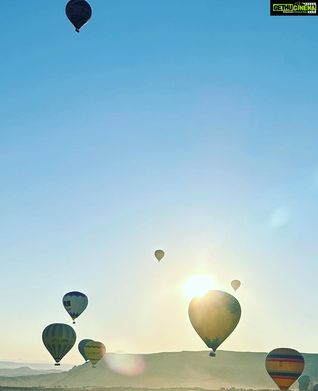 Gul Panag Instagram - Full of hot air. Literally. Our second time in Capadoccia. And just as magical. The hot air balloon ride is arguably one of the finest experiences that I’ve ever had. This time around, we had Nihal with us who was mesmerised. Seeing it all over again through his eyes, was an altogether different experience. Since we are here in the middle of summer, the days are very long , with sunrise at 5 AM. The balloon pilots typically take us up a little before so one can witness the sunrise in all its glory. Our pick up was at 3.45 AM. And Nihal was an absolute trooper. In fact, we woke up at 2.30 ( not unusual for Rishi, given his job💁🏻♀️,) cup of tea, when Nihal walked into the living room, rubbing his eyes. Hence, proved yet again, there are children will surprise us again and again. Like he did on the trek up to the Tigers’s nest in Bhutan are early this year. #travel #turkey #familytravel #travelgram Cappadocia