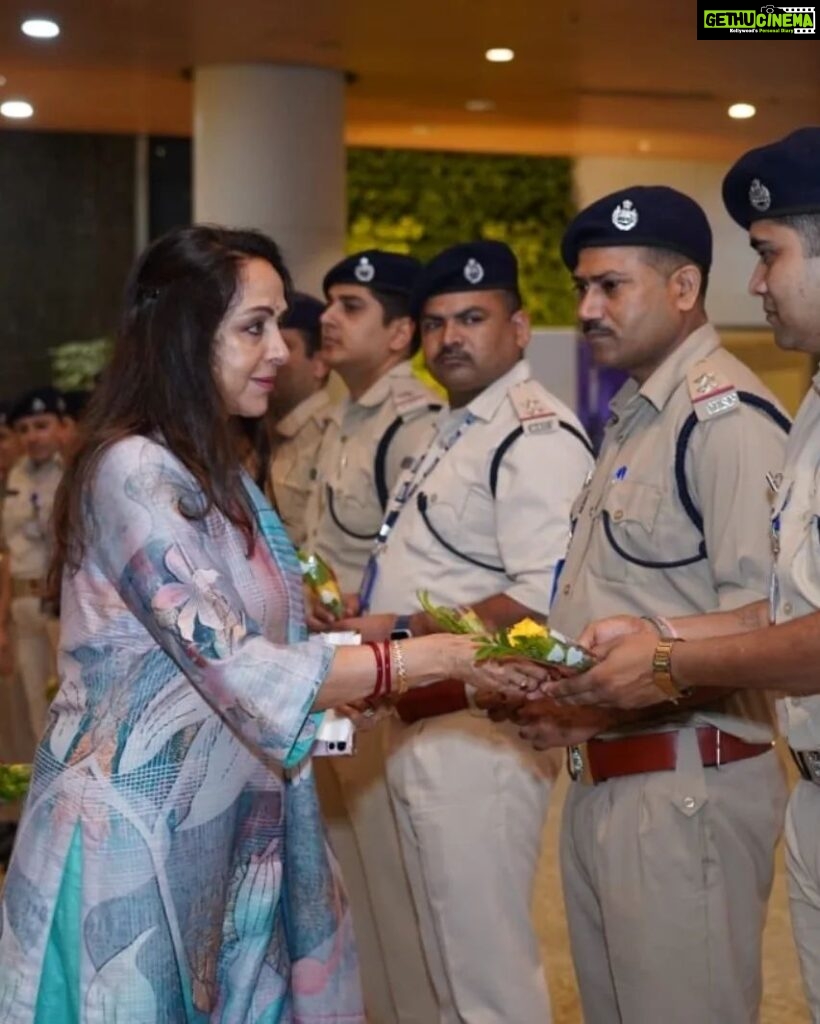 Hema Malini Instagram - I would like to congratulate the Ministry of Civil Aviation & DG BCAS for initiating the Aviation Security Culture Week across India with an endeavor to raise awareness on Aviation security with a commitment to make air travel safe for all. Thank you CISF and the entire team of Security professionals at Mumbai International Airport, for making our journey safe and secure. Remember, Security is everyone’s responsibility -  See it. Say it. Secure it. I would also like to thank CISF and Airline security staff who were assembled (20-30 staff) on my way, post security and I appreciate their efforts in making Air travel safe and secure at Mumbai Airport.@csmia_official for Mumbai Airport @MOCA for Ministry of Civil Aviation @moca_goi #securityculturalweek #mumbaiaviation #mumbaiinternationalairport