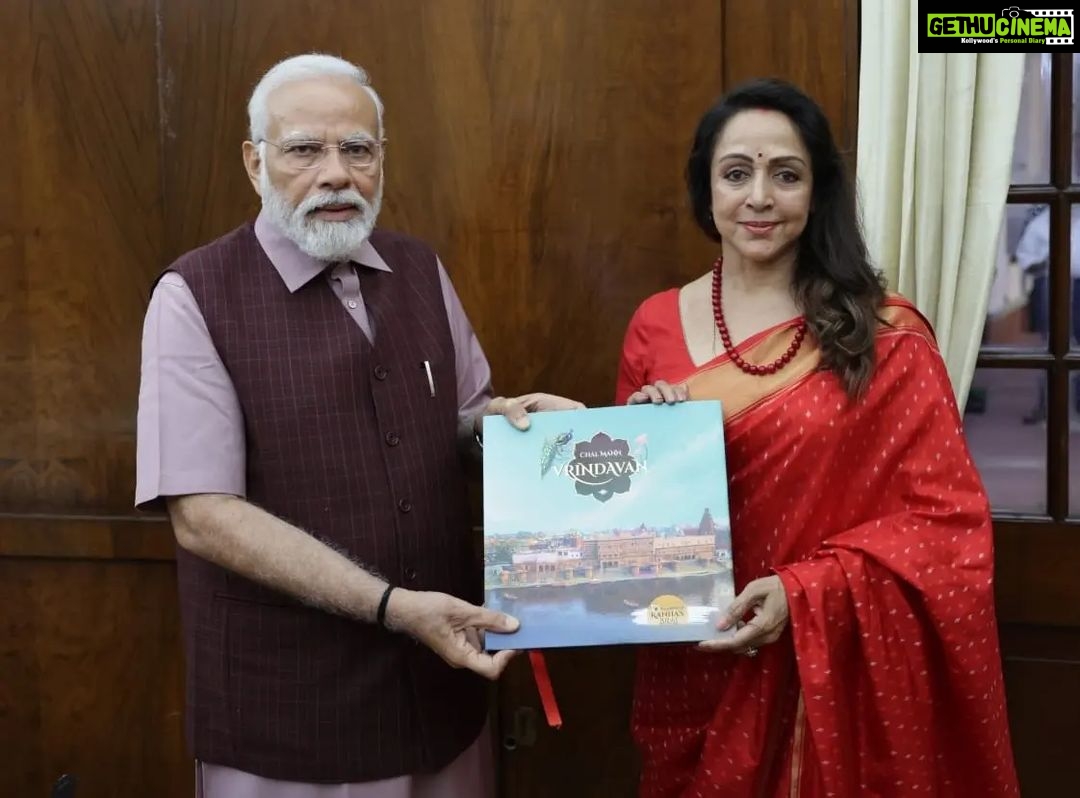 Hema Malini Instagram - Had the proud privilege of meeting PM Modi ji and handing over the first copy of Chal Mann Vrindavan, a beautiful coffee table book for which I am Chief Editor. The book with its unique, glossy photographs of the temples and edifices of Mathura-Vrindavan, will be a tourism booster. Modi ji was impressed with the beautifully compiled book and expressed his admiration. I also took the opportunity to seek his help to complete special ongoing projects that will leave an impact on Vraj for many years to come. #vrindavan #coffeetqblebook