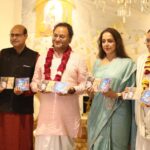Hema Malini Instagram - On the joyous occasion of Holi I celebrated the festival of colours in the traditional Braj style at the Radha Raman Temple along with all the Brijwasis and also released my latest Bhajan "Shyam rang mein mai to rang gayi..." produced by Kavi Narayan Agarwal with music by Vivek Prakash. Also present at the event was Vaishnavacharya Shri. Abhishek Goswami Ji. #happyholi2023 #holi #celebration #festival #mathura #vrindavan #radharamantemple #bhajan #narayanagarwal #vivekprakash