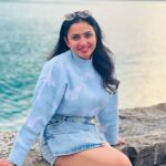 Janani Ashok Kumar Instagram - Life is a series of thousand little miracles, just notice them & feel them while it lasts…! ✨💫💯☃️ 🦋 - 📸: @madhumitha_sivasankar Denim skirt : @zara Sweater: @hm Sunglass: @moschino 👟: @puma #livinginthemoment Lake Brienz, Switzerland