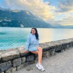 Janani Ashok Kumar Instagram - Life is a series of thousand little miracles, just notice them & feel them while it lasts…! ✨💫💯☃️ 🦋 - 📸: @madhumitha_sivasankar Denim skirt : @zara Sweater: @hm Sunglass: @moschino 👟: @puma #livinginthemoment Lake Brienz, Switzerland