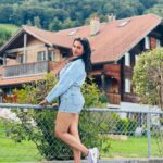 Janani Ashok Kumar Instagram - Life is a series of thousand little miracles, just notice them & feel them while it lasts…! ✨💫💯☃️ 🦋 - 📸: @madhumitha_sivasankar Denim skirt : @zara Sweater: @hm Sunglass: @moschino 👟: @puma #livinginthemoment Lake Brienz, Switzerland