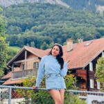 Janani Ashok Kumar Instagram - Life is a series of thousand little miracles, just notice them & feel them while it lasts…! ✨💫💯☃️ 🦋 - 📸: @madhumitha_sivasankar Denim skirt : @zara Sweater: @hm Sunglass: @moschino 👟: @puma #livinginthemoment Lake Brienz, Switzerland