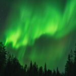 Jayam Ravi Instagram - ‘Those who don’t believe in magic will find it here’ 💚🇫🇮 . . . . 📸 @lappimeri #laplandlove #auroraborealis #northernlights #finnishlapland #magic #coupletravel #travelgram #finland2023 #visitfinland #happycountry #bucketlistcheck #chasinglights #chasingdreams