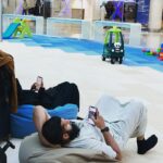 Kalki Koechlin Instagram - Parents taking a break😅 #bahrainairport #kidsplaycentre #phonebuddiesforever #transit