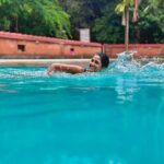 Keerthi Pandian Instagram - Serenity when in my element 🌊🌧️ And also in one of my MOST favourite places @adishaktitheatre 🩵 Photo courtesy @ash_warrier darling! #waterbaby #swim Adishakti Theatre